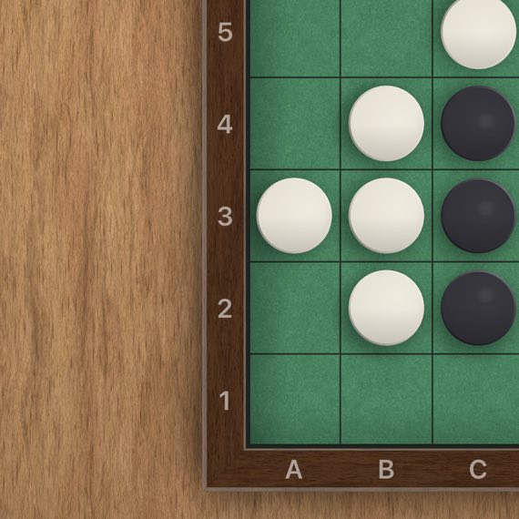 Reversi on an iPad, the corner of the reversi board on a pale wooden table.